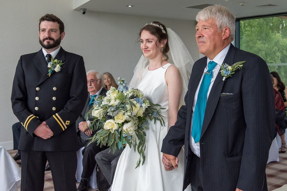 Gina is walked down the aisle at the KP Club, Pocklington, to marry Matt.