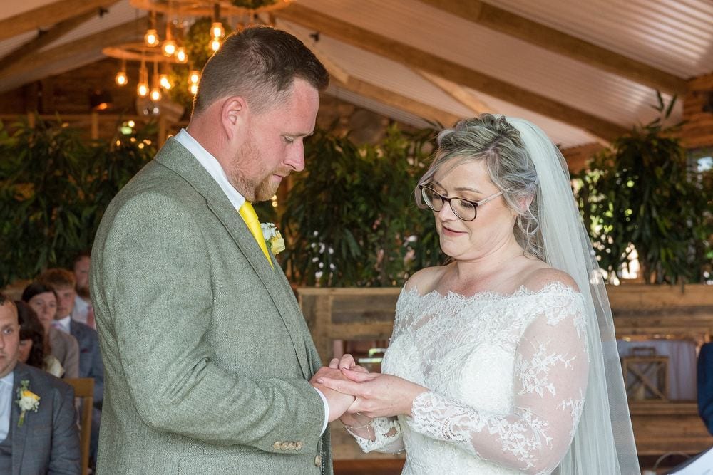 Ben & Danielle exchange wedding rings during their ceremony at Woodstock Weddings, York.