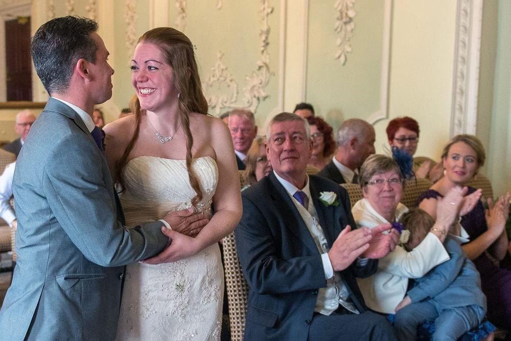Geraldine & Simon celebrate as their guests applaud at The Bridge Hotel & Spa, Wetherby.