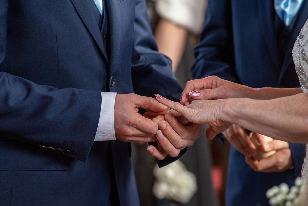 A close-up of rings being exchanged at Bedern Hall, York.