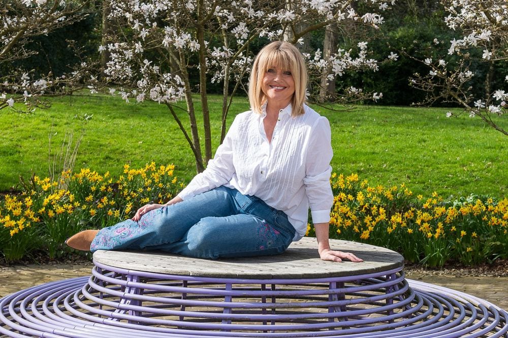 TV presenter Christine Talbot posing on a wire bench at Rudding Park.