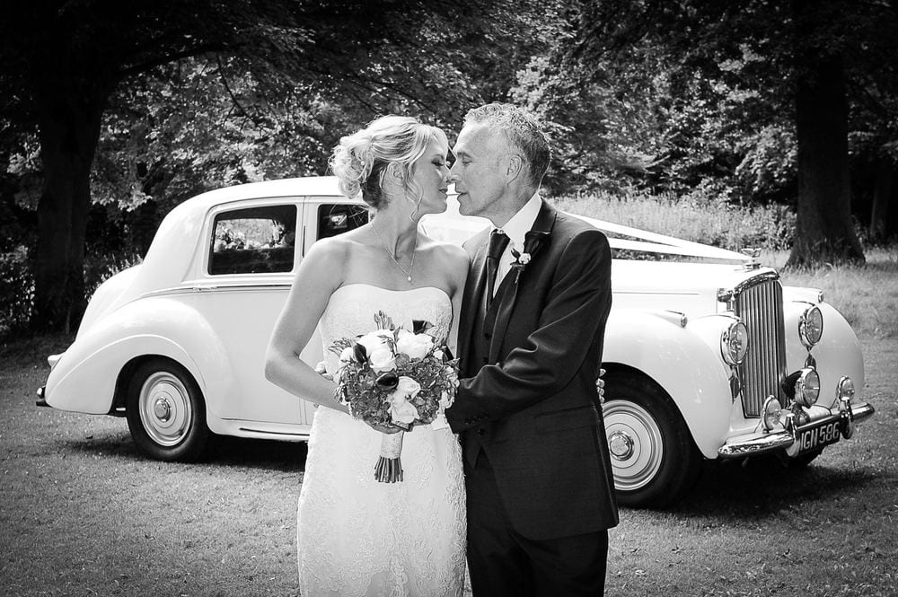 Kathy & Sean with their vintage wedding car at Normanby Hall & Country Park, Scunthorpe.