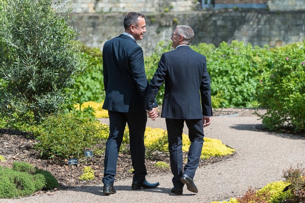 Roger & Mark take a quiet walk after their wedding in the Museum Gardens.