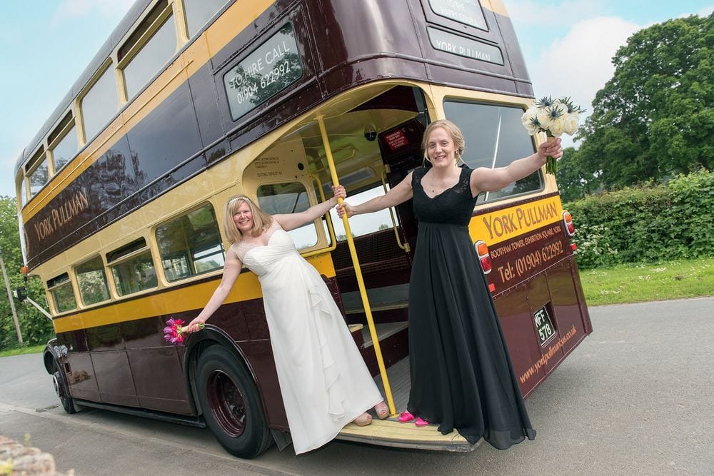 Helen & Hanneke with the vintage bus their guests arrived on.