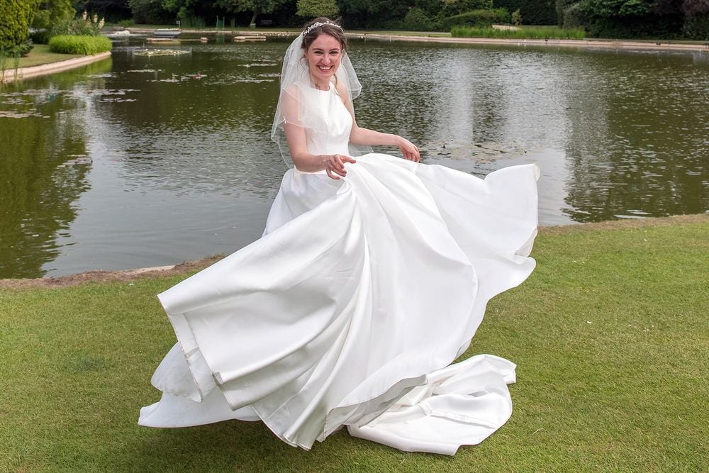 Georgina spins in her wedding dress at Burnby Hall Gardens, Pocklington.