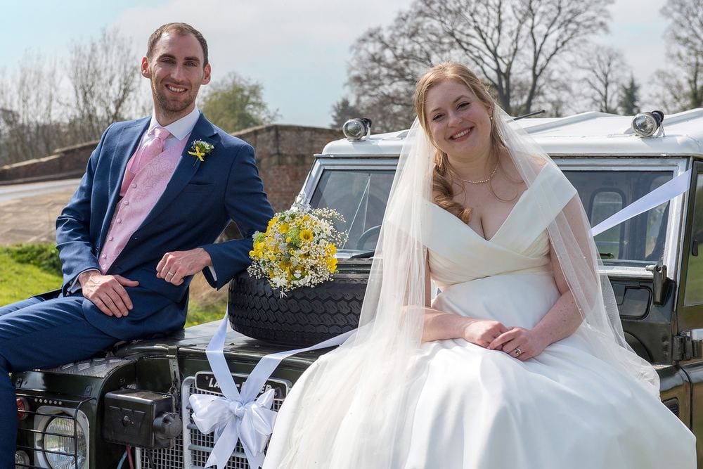 Tim & Hannah on their vintage Land Rover.