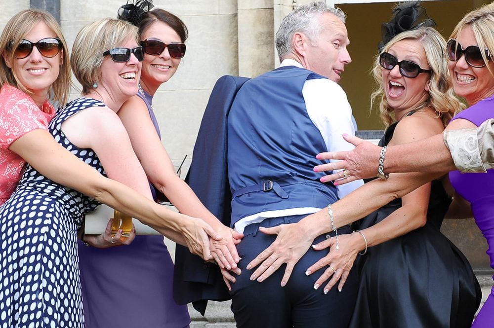 A fun moment as guests tease the groom.