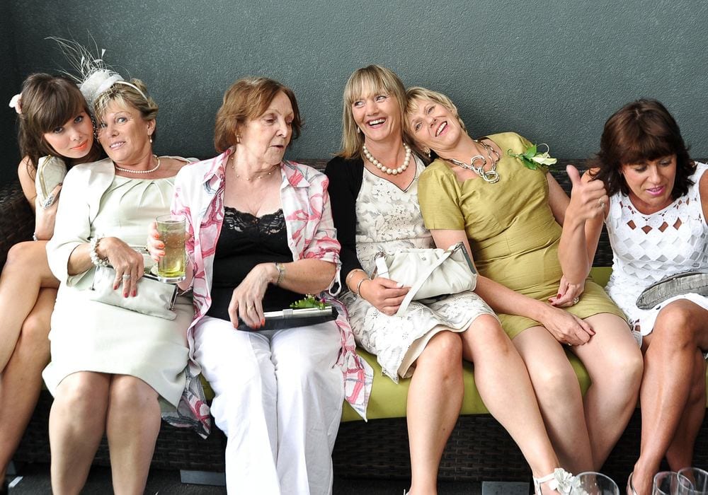 Three generations of wedding guests share a joke at the KP Club, Pocklington.