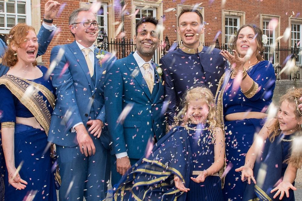 Confetti fun for Chat & Ben with their bridesmaids and best man outside The Grand Hotel, York.