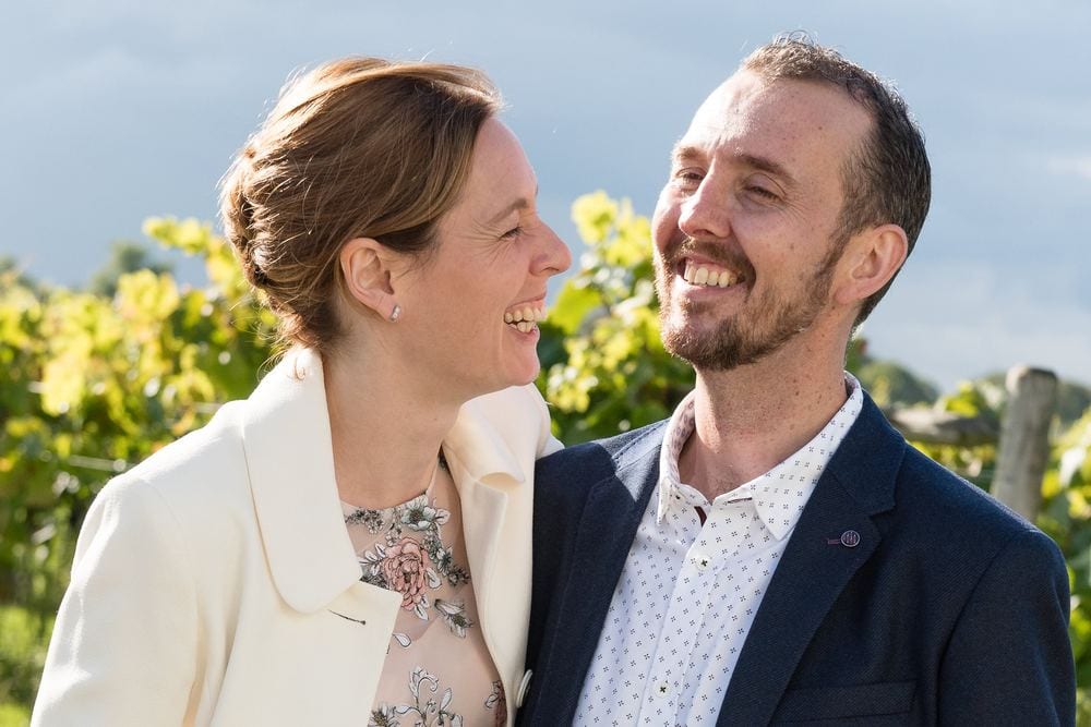 A happy couple in a vineyard.