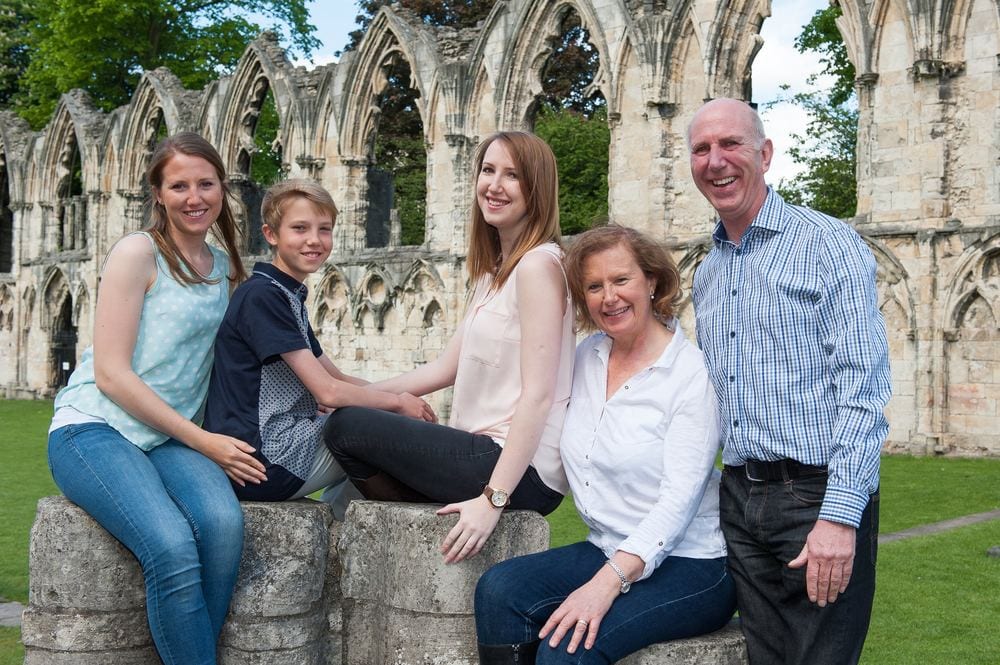 A family portrait in the Museum Gardens, with St Mary's Abbey behind them.